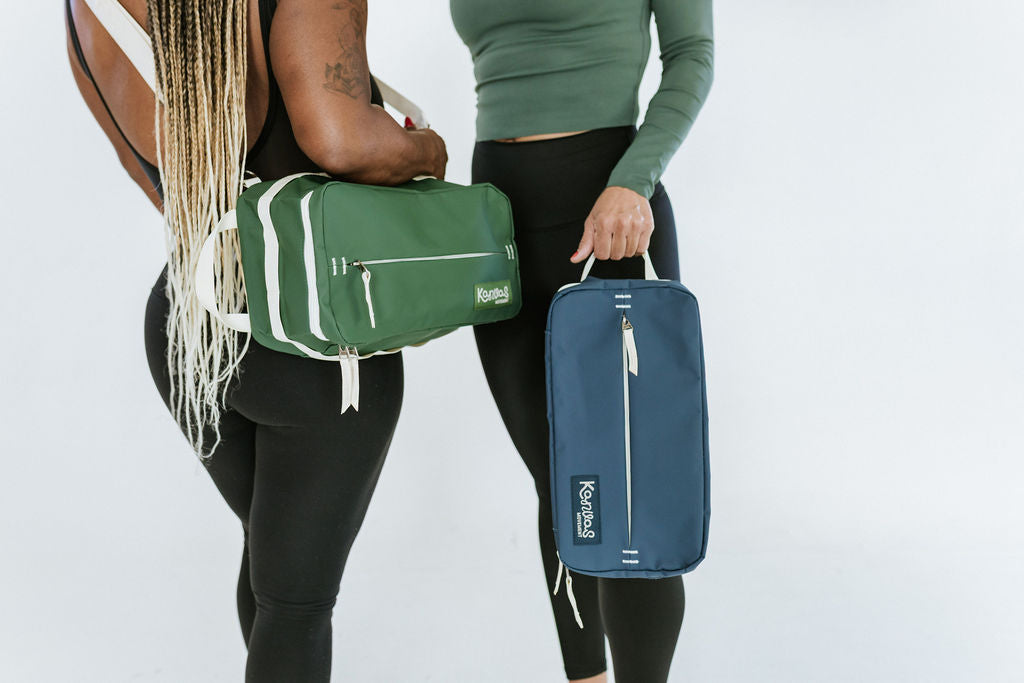 A green and blue bag with carry straps 