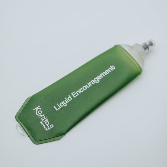 A green soft flask with the words "liquid encouragement" and the logo Kanvas Movement 