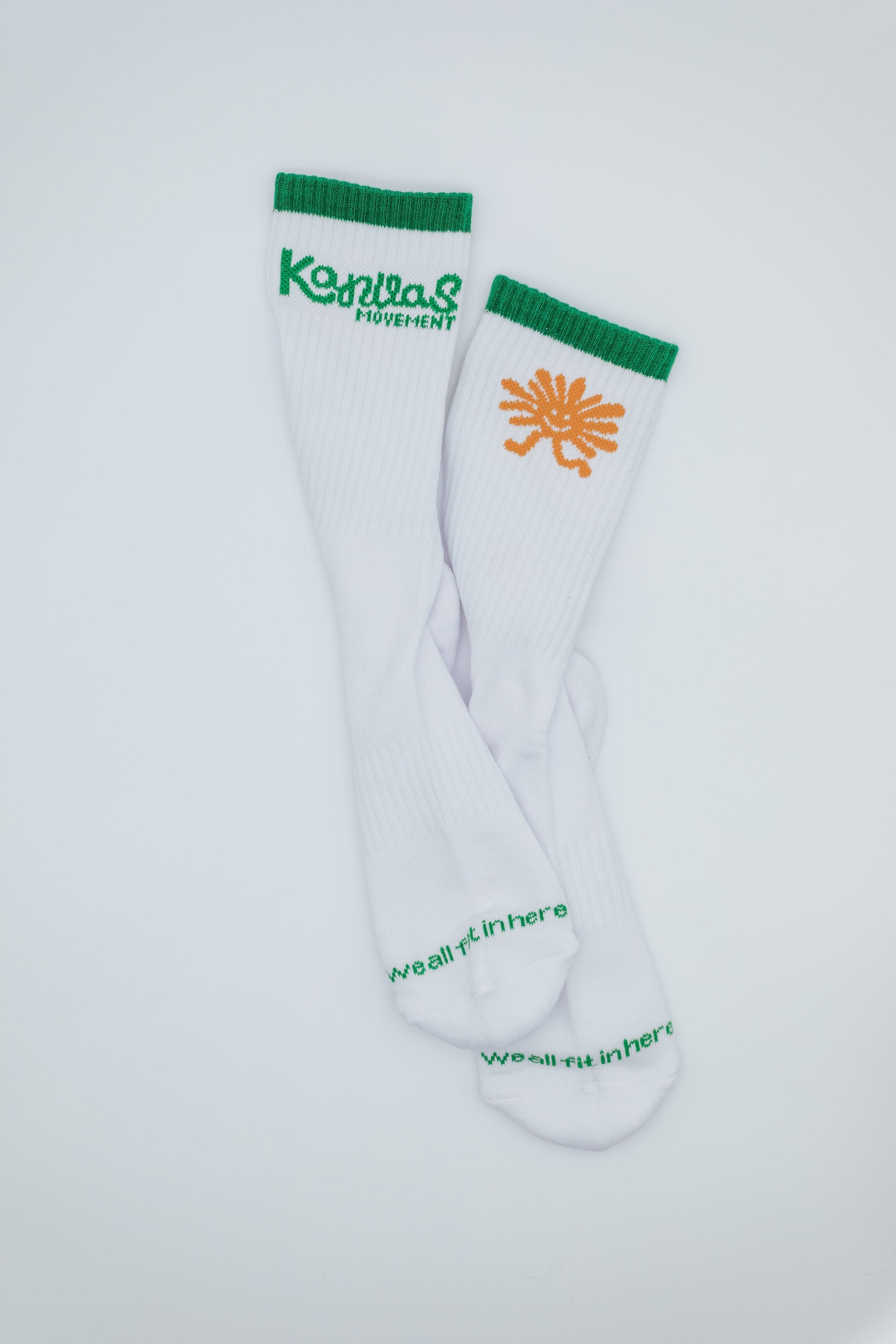 White socks with Kanvas Movement in green and orange sun character  on a white background